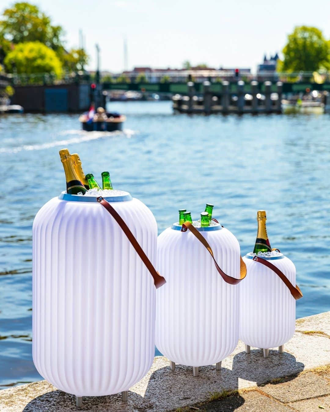 Side view of three wine coolers on the banks of the Spaarne in Haarlem Side view of three wine coolers on the banks of the Spaarne in Haarlem