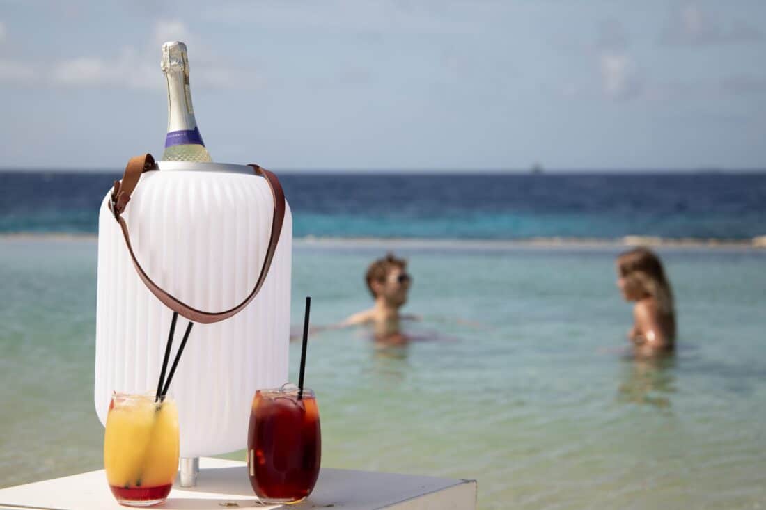 wine cooler, speaker and lighting in a summery setting on the beach wine cooler, speaker and lighting in a summery setting on the beach